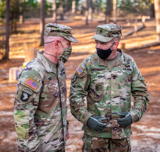 FORT BENNING, Ga. – Command Sgt. Maj. Robert K. &#34;Rob&#34; Fortenberry (right), senior enlisted leader of the U.S. Army Infantry School, talks with Command Sgt. Maj. Todd Sims of U.S. Army Forces Command (FORSCOM) Jan. 29 at Fort Benning. Sims was among senior enlisted leaders from various units, including XVIII Airborne Corps, who watched new Infantry recruits go through &#34;The First 100 Yards,&#34; a set of team-building events designed to get them off to a proper start on their first day of training. Fortenberry, a veteran Infantryman who retires this summer after more than 30 years in the Army, had a central role in developing the new method, which replaces the traditional &#34;shark attack&#34; in which new recruits were greeted by snarling drill sergeants shouting belittling comments. Fortenberry became the Infantry School&#39;s senior enlisted leader in 2019 and is scheduled to relinquish his responsibilities in a ceremony here Feb. 22.

(U.S. Army photo by Patrick A. Albright, U.S. Army Maneuver Center of Excellence and Fort Benning Public Affairs)