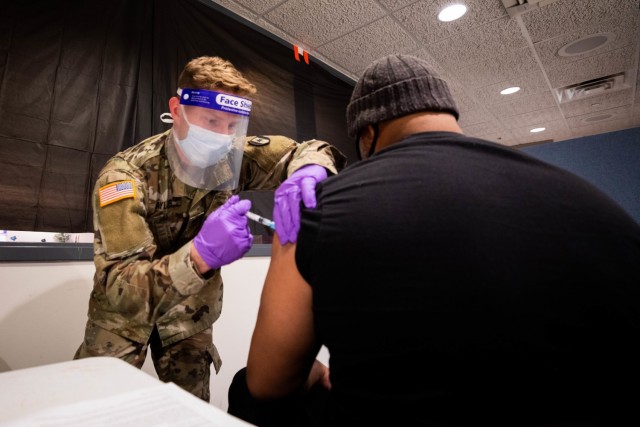 Army Spc. Cody Taylor, assigned to the Urban Augmentation Medical Task Force-531, based out of Fort Campbell, Ky., administers a COVID-19 vaccine to a local New Jersey citizen in support of COVID-19 vaccine operations. U.S. Northern Command,...