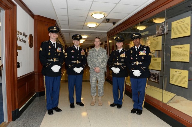 Sgt. 1st Class Michael Raines (left), a military police Soldier with the 29th Military Police Company, Maryland Army National Guard, poses for a photo with former Sergeant Major of the Army Daniel Dailey at the Pentagon in Washington D.C. in December 2014. Raines served as security while on special assignment for the Joint Staff. During brief encounters with senior leaders, Raines said he came to fully understand the “this is my squad” concept, which emphasizes taking care of Soldiers and empowering leaders. (Courtesy photo)