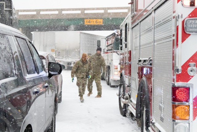 Staff Sgt. Josh Jacox, 2120th Engineer company, 120th engineering battalion, Oklahoma Army National Guard and Spc. Parker Sargent, electrician specialist, 2120th Engineer company, 120th engineering battalion, Oklahoma Army National Guard, assist...