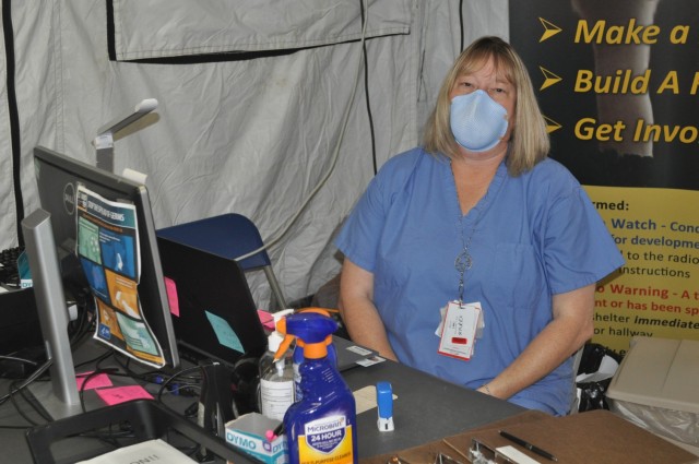 Martin Army Community Hospital Medical Support Assistant Tara Hopkins works in BMACH's pandemic tent.