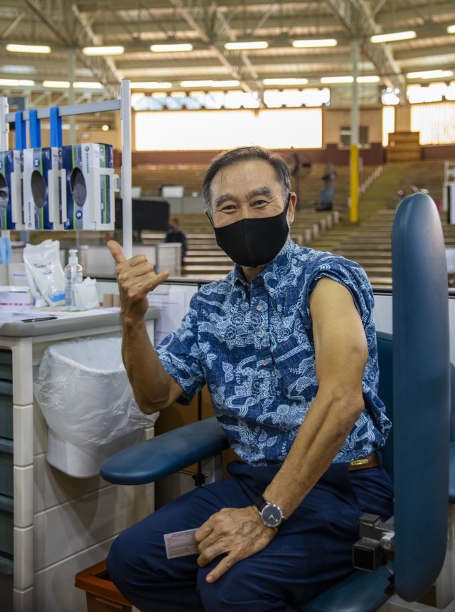 Members of the 402nd Army Field Support Brigade receive their first dose of the COVID-19 vaccine.