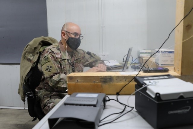 Chief Warrant Officer David Lente, who leads the Syrian Logistics Cell military intelligence team or S-2, at Erbil Air Base, Iraq, reviews a truck driver’s record Feb. 5, 2021. Lente said if a driver is flagged, he then conducts a further review. (U.S. Army photo by Capt. Elizabeth A. Rogers)
