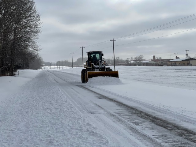 A snow plow clears a road Feb. 14 at Fort Campbell. The garrison team, specifically Directorate of Public Works, Directorate of Plans, Training, Mobilization and Securty, and the Directorate of Emergency Ser-vices, have shouldered the lion’s...