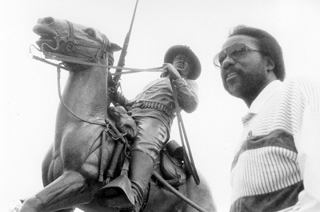 Artist Eddie Dixon, sculptor of the Buffalo Soldier Monument, poses for a photo at the monument shortly before its dedication in 1992. Fort Leavenworth Lamp file photo by Michael Tolzmann
