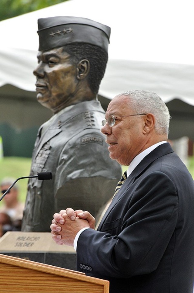 Retired Gen. Colin Powell, first African-American chairman of the Joint Chiefs of Staff and U.S. secretary of state, talks about how the idea for the Buffalo Soldier Monument came to him and why it was so important to him during his remarks at the unveiling ceremony of a bust in his likeness in the Circle of Firsts in the Buffalo Soldier Commemorative Area Sept. 5, 2014. Photo by Prudence Siebert/Fort Leavenworth Lamp