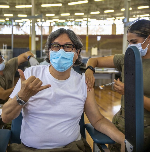 Members of the 402nd Army Field Support Brigade receive their first dose of the COVID-19 vaccine.