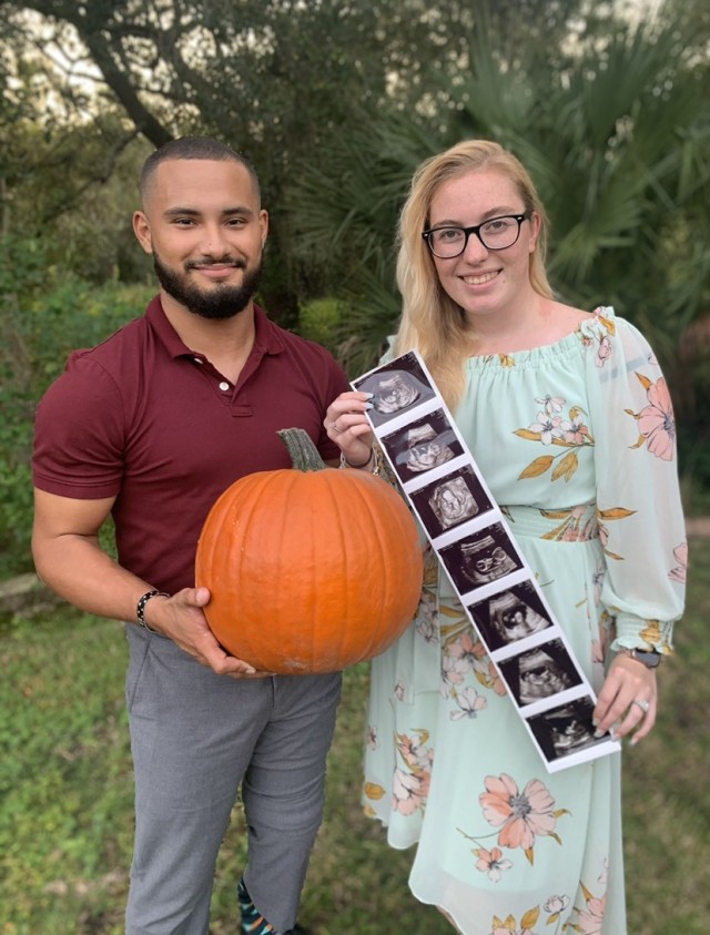 Spc. Zedrick Gonzalez and his wife Jennifer pose outside of their new home in Palmetto, Florida. (Photo by Spc. Zedrick Gonzalez)