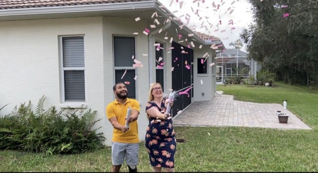 Spc. Zedrick Gonzalez and his wife Jennifer pose outside of their new home in Palmetto, Florida. (Photo by Spc. Zedrick Gonzalez)