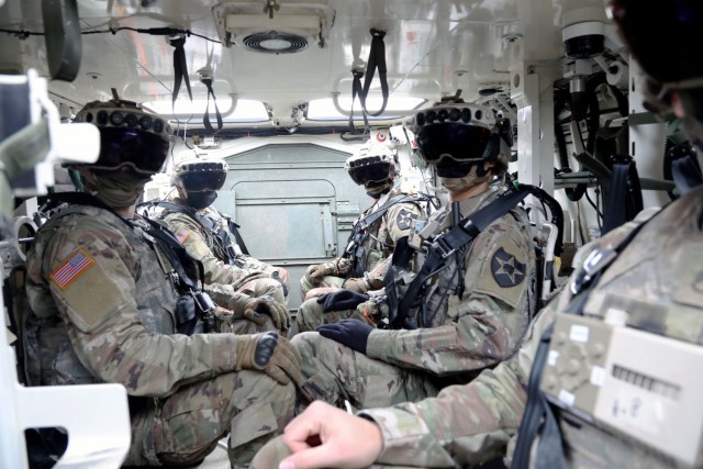 Soldiers don the Integrated Visual Augmentation System Capability Set 3 hardware while mounted in a Stryker in Joint Base Lewis-McCord, WA.