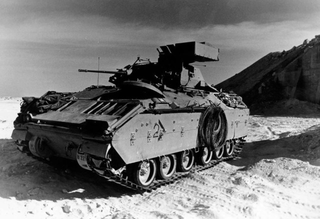 This is a left front quarter view of an M-2 Bradley Infantry Fighting Vehicle  shown on Nov. 20, 1990, at the Theater Ammunition Supply Point outside Dhahran, Saudi Arabia in the Eastern Province while the Soldiers were on guard duty. (XVIII...