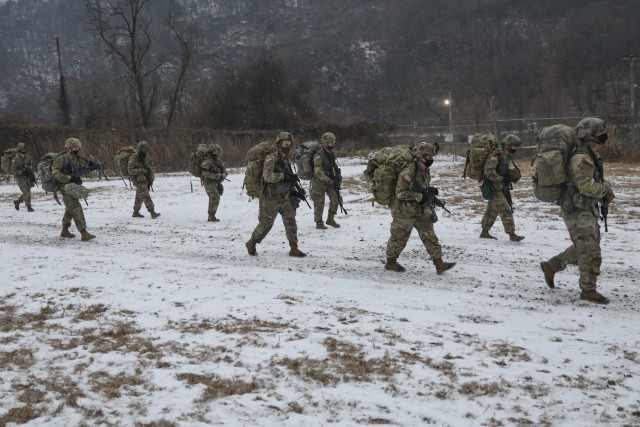 Soldiers assigned to 1st Armored Brigade Combat Team, 3rd Infantry Division ruck to their next station during the 2020 Warpaint Spur Ride, December 22-23, at Camp Casey/Hovey, Republic of Korea. The Spur Ride is a tradition in which Soldiers strive to earn spurs, an honorable award worn on their combat boots and a symbol of the ‘Order of the Spur,’ by completing rigorous challenges.  (U.S. Army photo by KSgt. Jin Ho Kwon, 1st Armored Brigade Combat Team, 3rd Infantry Division)