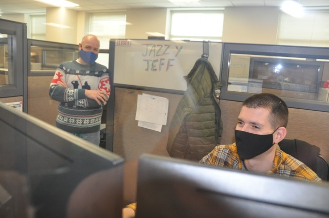 Information Technology Specialists like Randy Glenn, far left, and Jeffrey Nauta, who work for the Army Materiel Command at Redstone Arsenal, are now part of the Technology Career Field established by the Army in October 2020. The Information...