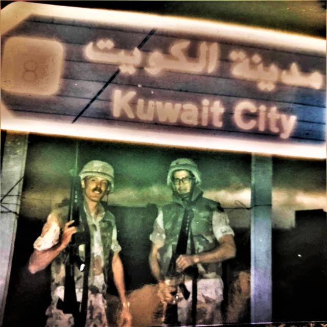 Army Sgts. Mark Christensen and Phillip Cornelius with the 890th Transportation Company, an Army Reserve unit based in Green Bay, Wis., are shown in Kuwait City, Kuwait, on Feb. 27, 1991. Both Soldiers were part of the deployed 766th...