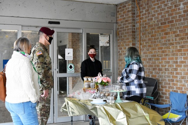 Brig. Gen. David S. Doyle (second from left), Joint Readiness Training Center and Fort Polk commanding general, visits a military-spouse owned home-based, business booth at an event Feb. 6 in the old Commissary parking lot.