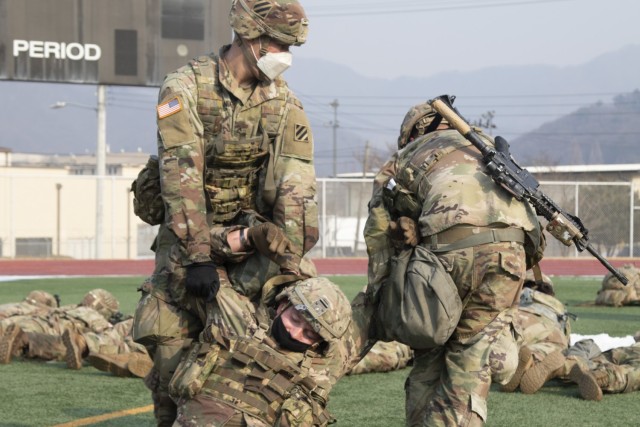 Soldiers assigned to 1st Armored Brigade Combat Team, 3rd Infantry Division practice evacuating a teammate during the 2020 Warpaint Spur Ride, December 22-23, at Camp Casey/Hovey, Republic of Korea. The Spur Ride is a tradition in which Soldiers strive to earn spurs, an honorable award worn on their combat boots and a symbol of the ‘Order of the Spur,’ by completing rigorous challenges.  (U.S. Army photo by KPfc. Seong Min Choi, 1st Armored Brigade Combat Team, 3rd Infantry Division)