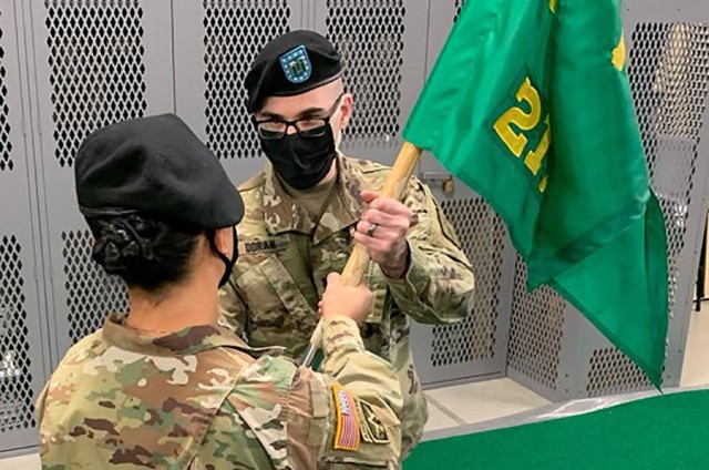 Capt. John J. Doran II receives the 217th Military Police Detachment guidon from Col. Karin L. Watson, Fort Lee garrison commander, during a change of command ceremony Thursday at the unit headquarters. Doran replaced Capt. Daniel S. Nagle who has...