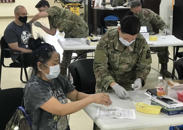 Caregivers at the Camp Arifjan, Kuwait hospital administered second-dose vaccinations Feb. 15, 2021 and Feb. 17, 2021 to civilian and military medical professionals. The first phase of the COVID-19 vaccination rollout in the Middle East area of...