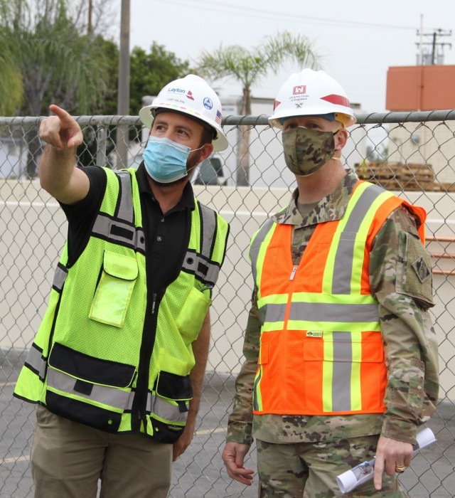 Luke Halpin, construction manager with Layton Construction Company, left, talks with Brig. Gen. Paul Owen, U.S. Army Corps of Engineers South Pacific Division commander, during Owen’s Feb. 9, 2021, visit to Beverly Community Hospital in...