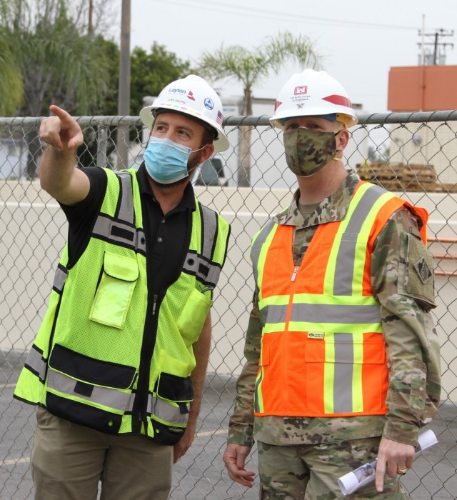 Luke Halpin, construction manager with Layton Construction Company, left, talks with Brig. Gen. Paul Owen, U.S. Army Corps of Engineers South Pacific Division commander, during Owen’s Feb. 9, 2021, visit to Beverly Community Hospital in Montebello, California, to see construction progress there, including upgrades to a 17-bed wing in the facility for non-COVID patients and the conversion of a pre-operation waiting room to a COVID staging area through the addition of high-flow oxygen.