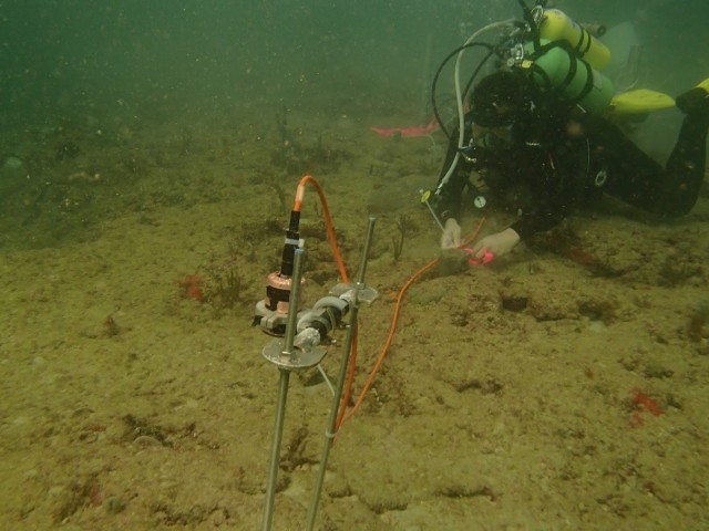 U.S. Army Engineer Research and Development Center research scientist and diver John Bull (ERDC-CHL) ensuring the sensors are placed properly on the ocean’s floor for monitoring. (Courtesy photo by U.S. Army Engineer Research and Development Center)