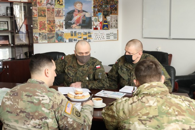 U.S. Army leaders, 1st Squadron, 2d Cavalry Regiment, enhanced Forward Presence Battle Group Poland, meet with Polish Army leaders from 1st Battalion, 15th Mechanized Brigade, February 11, 2021, in Orzysz, Poland to discuss cooperation on exciting upcoming joint-training exercises.(U.S. Army photo by Staff Sgt. Elizabeth O. Bryson)