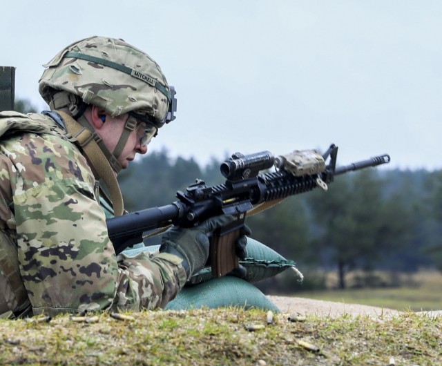 Sgt. Jackson Mitchell, assigned to 2nd Cavalry Regiment, conducts a functions check on his M4 carbine during the Marksmanship Master Trainers course, Grafenwoehr Training Area, Germany, Feb. 3, 2021. The MMT course is used to train Soldiers on...