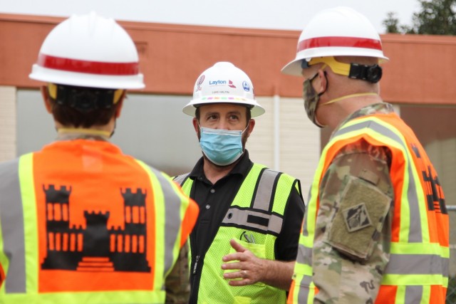 Luke Halpin, construction manager with Layton Construction Company, center, talks with Brig. Gen. Paul Owen, U.S. Army Corps of Engineers South Pacific Division commander, right, during Owen’s Feb. 9, 2021 visit to Beverly Community Hospital in Montebello, California, to see construction progress there, including upgrades to a 17-bed wing in the facility for non-COVID patients and the conversion of a pre-operation waiting room to a COVID staging area through the addition of high-flow oxygen. At left is Col. Julie Balten, Los Angeles District commander.