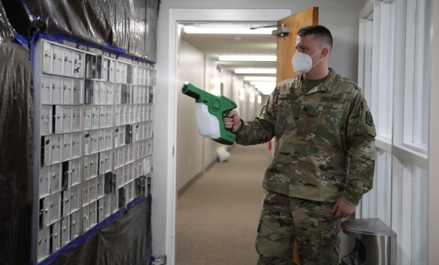 Kentucky National Guard Spc. Quinton Boyd, assigned to a Facility Assistance Support Team, sanitizes mailboxes with an electrostatic sprayer at Sayre Christian Village, Lexington, Ky., Feb. 3, 2021. Gov. Andy Beshear directed troops to assist at long-term health care facilities in COVID-19 hot spots throughout Kentucky.