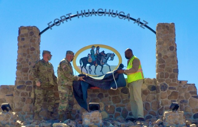 Garrison commander, Col. Jarrod Moreland; Command Sgt. Maj. James Prasse; and Kevin Blackwell, architect/community planner at the Directorate of Public Works; unveiled the new sign indicating access to the fort&#39;s Van Deman Gate at the...