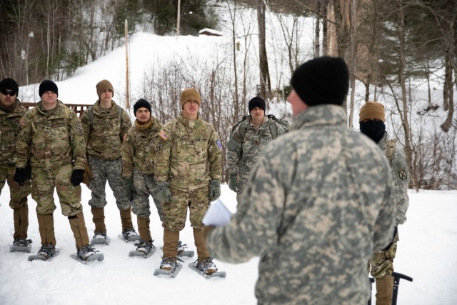 Soldiers from  Bravo Company, 41st Brigade Engineer Battalion, 2nd Brigade Combat Team, 10th Mountain Division (LI), listen to an instructor from the Army National Guard&#39;s 86th Infantry Brigade Combat Team talk about avalanche awareness and survival techniques at Camp Ethan Allen Training Site in Jericho, Vt., Feb. 19, 2021. As a reward for completing the D-Series challenge on Feb. 9-10, 2021, and placing as one of the top three teams, the 41st BEB as well as other 10th Mountain Div. Soldiers had the opportunity to learn mountain warfare tactics to include ice wall climbing,  casualty evacuation through rough terrain and avalanche awareness training. (U.S. Army photo by Sgt. Elizabeth Rundell, 27th Public Affairs Detachment)