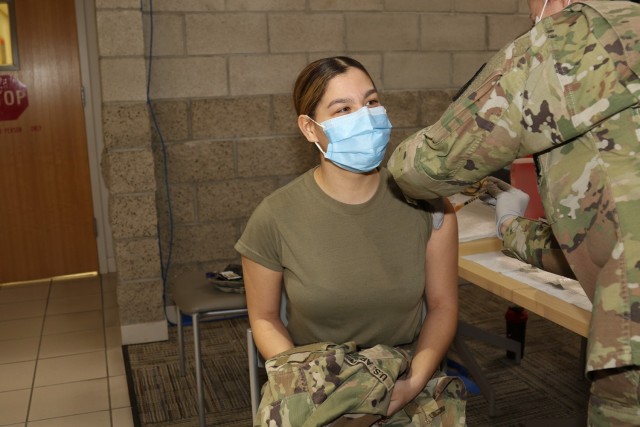 Spc. Arielle Castro, a preventive medicine specialist with Weed Army Community Hospital receives the Moderna COVID-19 vaccine January 12 at the Mary E. Walker Center on Fort Irwin, Calif. Castro, a Leominster, Mass., native was previously diagnosed with COVID-19 and said she chose to get the COVID-19 vaccine to protect her family. (U.S. Army photo by Kimberly Hackbarth/ Weed ACH Public Affairs)