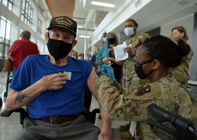 Maj. Carla Cox, 59th Medical Wing commander’s executive officer, vaccinates a San Antonio Military Health System beneficiary, Feb. 6, 2021, at Wilford Hall Ambulatory Surgical Center, Joint Base San Antonio-Lackland, Texas. For more information...