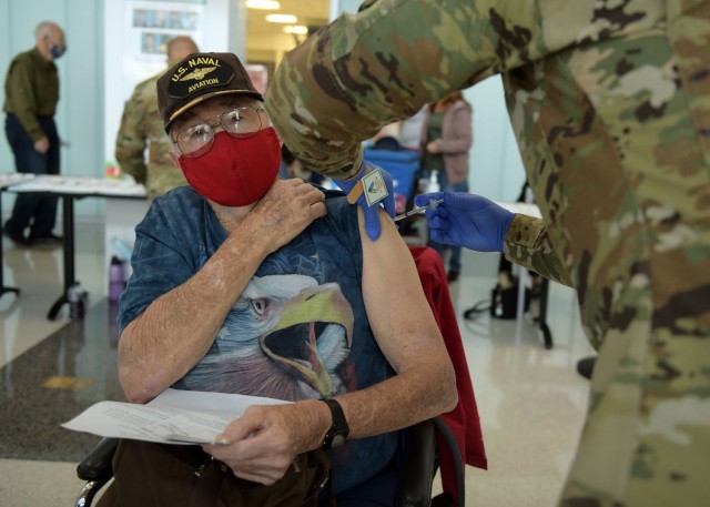 A 59th Medical Wing medic vaccinates a San Antonio Military Health System beneficiary, Feb. 6, 2021, at Wilford Hall Ambulatory Surgical Center, Joint Base San Antonio-Lackland, Texas. For more information on what tier the San Antonio Military...