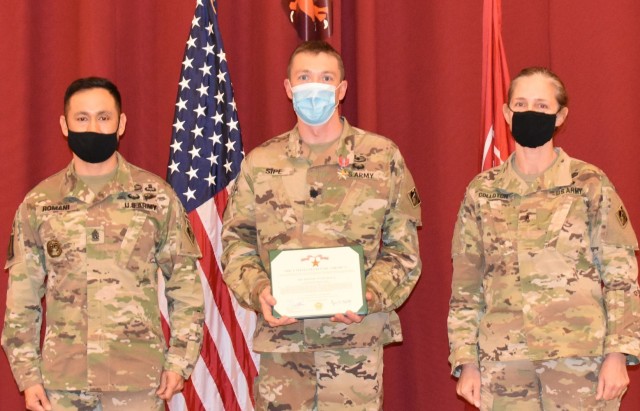 Lieutenant Colonel Paul Sipe, Afghanistan District is presented the Bronze Star Medal from Transatlantic Division Command Sergeant Major Delfin Romani and Brigadier General Kimberly Colloton, Transatlantic Division Commander during a Town Hall...
