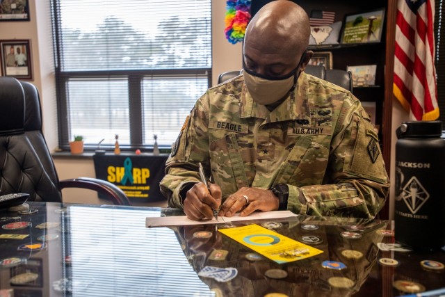 Fort Jackson Commander Brig. Gen. Milford H. "Beags" Beagle Jr. signs his pledge for the kickoff of the Army Emergency Relief campiagn, Feb. 17.