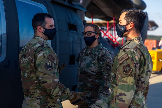 A group of Airmen, from the 621st Mobility Support Operations Squadron, discuss the process of preparing and moving the UH-60 Black Hawk onto a Lockheed C-5 Galaxy aircraft at Fort Hood, Texas, February 24, 2021.  The training was put on hold...