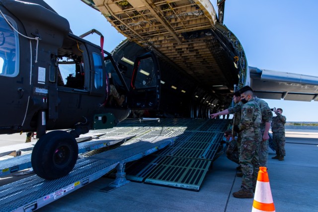 Soldiers and Airmen from 3rd Battalion, 227th Aviation Regiment, 1st Air Cavalry Brigade, 1st Cavalry Division and 621st Mobility Support Operations Squadron worked together to move the UH-60 Black Hawk into the Lockheed C-5 Galaxy aircraft at...