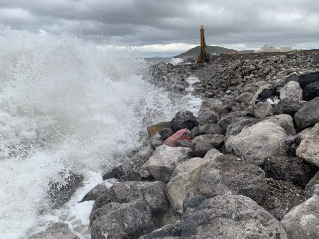 Waves batter the shoreline as crews work to repair the seawall at Cape Lisburne on Aug. 4, 2019. Major storms in 2011 and 2012 caused erosion to the previous structure, which impacted the use of the runway. Over five construction seasons, the U.S. Army Corps of Engineers – Alaska District worked with 611th Civil Engineer Squadron to make repairs to the seawall and ensure protection of the runway from the elements.