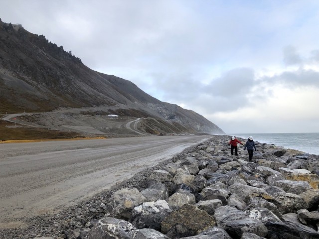 Julie Mages, deputy base civil engineer at the 611th Civil Engineer Squadron, and Lauren Oliver, hydraulic engineer at the U.S. Army Corps of Engineers – Alaska District, assess the seawall at Cape Lisburne on Sep. 30, 2019. The protective barrier prevents harsh waves and ice from flooding and damaging the adjacent runway, which serves as the primary avenue for people and supplies to reach the remote military base. The site is operated by the Pacific Air Forces Regional Support Center and provides aerospace surveillance to detect and allow for an early response to potential threats to North America.