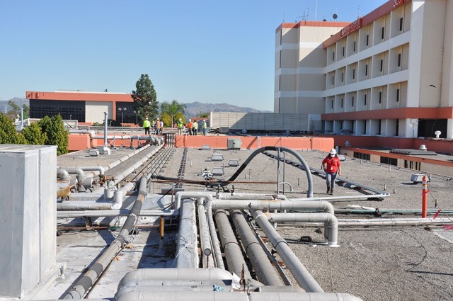 A team of state and federal representatives inspect progress by the U.S. Army Corps of Engineers on construction support at Beverly Hospital, Montebello, California, Feb. 23, 2021