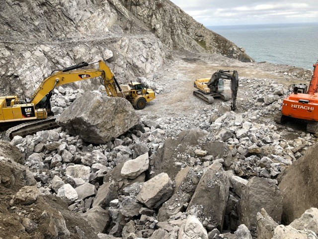 Workers excavate rocks from a quarry on property managed by the U.S. Fish and Wildlife Service near Cape Lisburne on Sep. 24, 2019. Repairs to the seawall required four different sized rocks, ranging from large boulders to small stones. Using the nearby quarry prevented the need to ship rocks from other sources and meant finishing the project at a quicker pace.