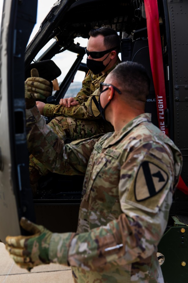 Sgt. Hunter Zweep, a Technical Inspector from 3rd Battalion, 227th Aviation Regiment, 1st Air Cavalry Brigade, 1st Cavalry Division instructs Sgt. Anthony Jones, in where to go for loading the UH-60 Black Hawk at Fort Hood, Texas, February 24,...
