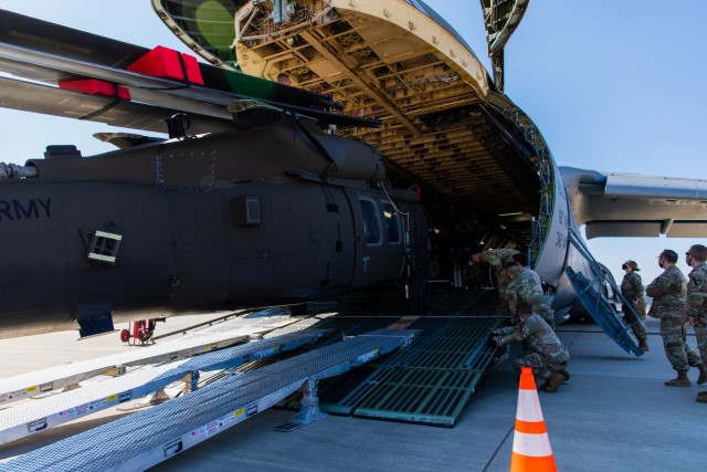 Soldiers and Airmen from 3rd Battalion, 227th Aviation Regiment, 1st Air Cavalry Brigade, 1st Cavalry Division and 621st Mobility Support Operations Squadron worked together to move the UH-60 Black Hawk into the Lockheed C-5 Galaxy aircraft at...