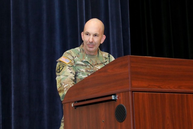Command Sgt. Maj. Robert Fortenberry relinquishes responsibility of the Infantry School to Command Sgt. Maj. Christopher Gunn, Feb. 22, in Derby Auditorium.