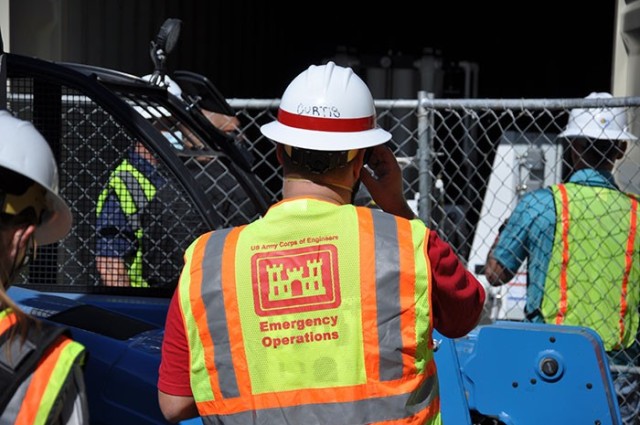A team of state and federal representatives inspect equipment during a briefing from the U.S. Army Corps of Engineers of construction support at Beverly Hospital, Montebello, California, Feb. 23, 2021.