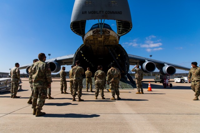 Soldiers and Airmen from 3rd Battalion, 227th Aviation Regiment, 1st Air Cavalry Brigade, 1st Cavalry Division and 621st Mobility Support Operations Squadron gathered to discuss how to move the UH-60 Black Hawk into the Lockheed C-5 Galaxy...