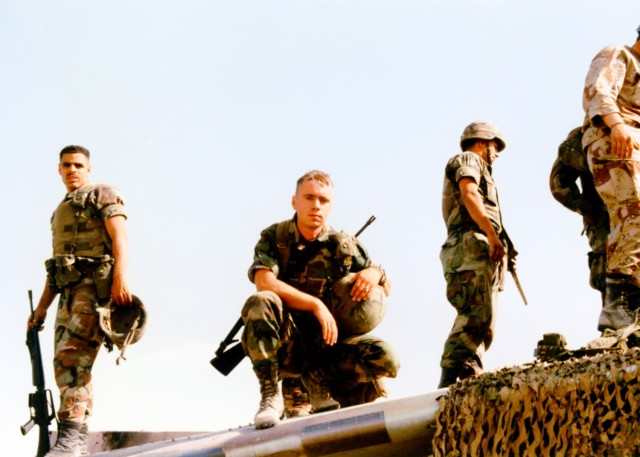 U.S. Army Spc. Delgado, left, explores a destroyed French Mirage F-1 outside of Baghdad, Iraq, during Operation Desert Storm in 1991 as part of the 3rd Battalion, 17th Field Artillery Regiment assigned to the 210th Artillery Brigade (Photo by...