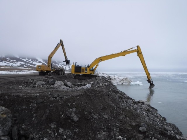 Crews work on the seawall as floating ice recedes at Cape Lisburne on May 23, 2020. Located 570 miles northwest of Fairbanks, construction on the remote project was limited to six months a year and took five work seasons to complete as workers contended with ice, waves and wildlife.