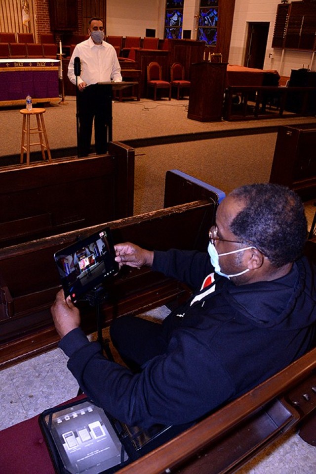 Chaplain (Maj.) Anselmo Brillon, Family Life chaplain, stands ready to begin teaching the "Family Wellness/Family Survival Skills" session in a series of Marriage Resilience classes as Walter McCollum Jr., audio-visual technician for the Fort...